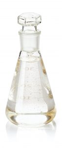 Erlenmeyer flask with serum and gold powder