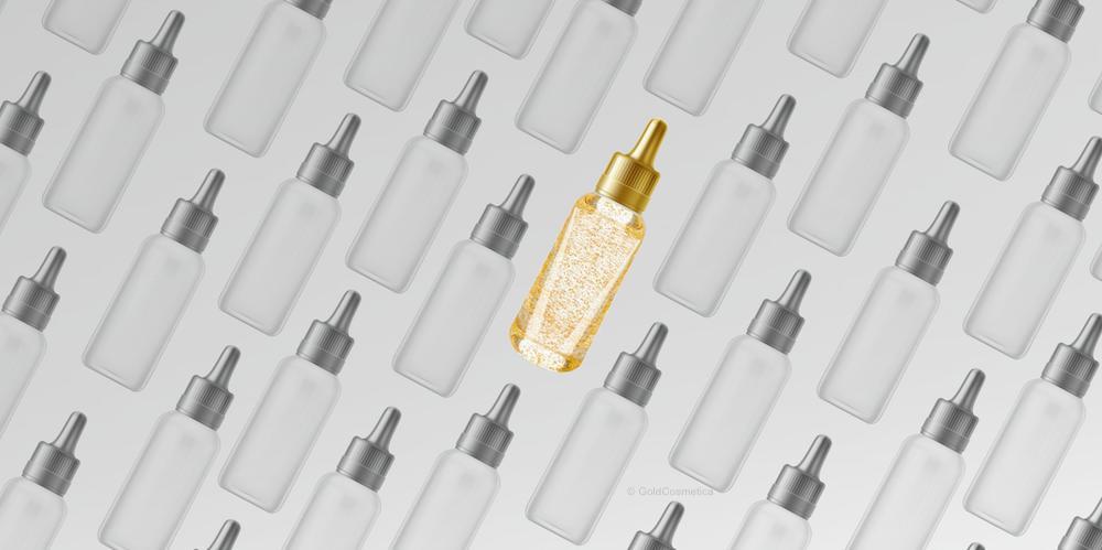 Serum bottle with cosmetic gold leaf by GoldCosmetica stands out between others