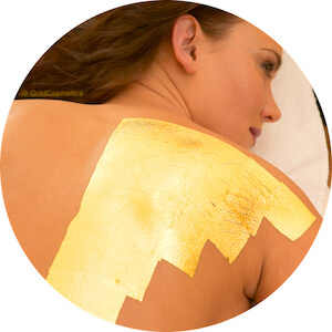 Applying GoldCosmetica Body Treatment on back